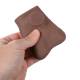 3B Scientific 1023302 SKINlike™ Testicle Examination Model - Dark Skin Tone, A Hand Squeezing the Training Model