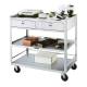 Lakeside Model 474 Stainless Steel Utility Table with 2 Drawers and 3 Shelves - In Use (Shown with Supplies, Not Included)
