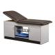 Clinton Cabinet Style Treatment Table with Two Closed Door and Open Center Shelf - Gunmetal Upholstery and Gray Laminate (The Items in the Cabinets in the Photo are Not Included.)